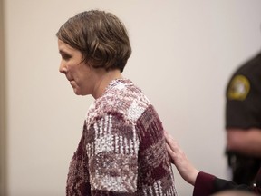 Tiffany Kosakowski appears before Judge Curt Benson at the Kent County Courthouse on Thursday, April 18, 2019 in Grand Rapids, Mich. Kosakowski pleaded guilty to reckless driving for running over her 9-year-old son while dropping him off at school and has been ordered to serve 30 days in jail. Benson sentenced her Thursday to 6 months in jail, with all but 30 days suspended. He called her actions "simply inexcusable."