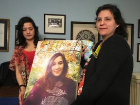 Tyra Denny, left, and Renee Denny hold a photo of their sister Cassidy Bernard at the Nova Scotia legislature in Halifax on Thursday, April 11, 2019. The family of a young Mi'kmaq woman found dead inside her home last October delivered statements at the Nova Scotia legislature today. The body of Cassidy Bernard, a 22-year-old mother, was found by police in We'koqma'q First Nation.