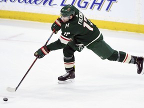 Minnesota Wild's Marcus Foligno (17) shoots the puck against the Winnipeg Jets during the third period of an NHL hockey game, Tuesday, April 2, 2019, in St. Paul, Minn. Foligno scored a goal on the play. The Wild won 5-1.