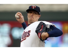 Minnesota Twins pitcher Kyle Gibson throws against the Toronto Blue Jays in the first inning of a baseball game, Tuesday, April 16, 2019, in Minneapolis.