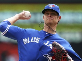 Toronto Blue Jays pitcher Clay Buchholz throws against the Minnesota Twins in the first inning of a baseball game Thursday, April 18, 2019, in Minneapolis.