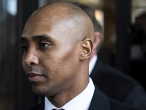 Former Minneapolis police officer Mohamed Noor leaves the Hennepin County Government Center after the first day of trial in Minneapolis on Monday, April 1, 2019. Noor is charged in the July 2017 death of Justine Ruszczyk Damond, who was killed after she called 911 to report a possible sexual assault behind her home.