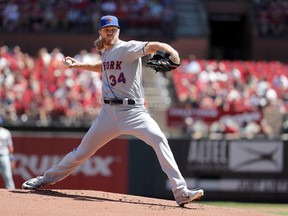New York Mets starting pitcher Noah Syndergaard throws during the first inning of a baseball game against the St. Louis Cardinals Sunday, April 21, 2019, in St. Louis.