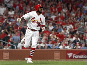 St. Louis Cardinals' Dexter Fowler celebrates as he rounds the bases after hitting a two-run home run during the fourth inning of a baseball game against the Milwaukee Brewers,Monday, April 22, 2019, in St. Louis.