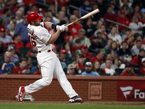 St. Louis Cardinals' Paul Goldschmidt follows through on an RBI-single during the fifth inning of a baseball game against the Milwaukee Brewers, Tuesday, April 23, 2019, in St. Louis.