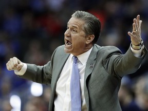 Kentucky head coach John Calipari yells to his players during the first half of the Midwest Regional final game against Auburn in the NCAA men's college basketball tournament Sunday, March 31, 2019, in Kansas City, Mo.