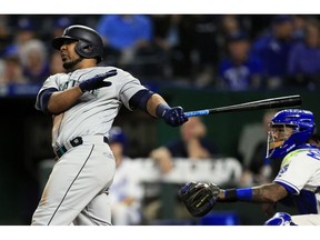 Seattle Mariners first baseman Edwin Encarnacion hits a three-run home run off Kansas City Royals relief pitcher Kevin McCarthy during the sixth inning of a baseball game at Kauffman Stadium in Kansas City, Mo., Monday, April 8, 2019. It was the second home run of the inning for Encarnacion.