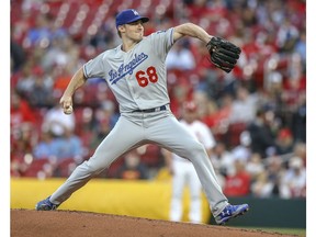 Los Angeles Dodgers starting pitcher Ross Stripling winds up during the first inning of the team's baseball game against the St. Louis Cardinals on Tuesday, April 9, 2019, in St. Louis.