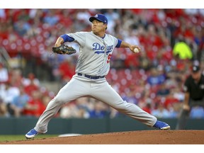 Los Angeles Dodgers starting pitcher Hyun-Jin Ryu throws during the first inning of a baseball game against the St. Louis Cardinals, Monday, April 8, 2019, in St. Louis.