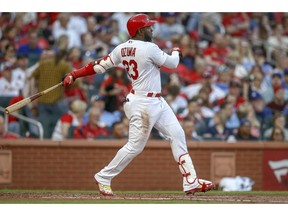 St. Louis Cardinals' Marcell Ozuna follows through on a two-run home run during the first inning of a baseball game against the Los Angeles Dodgers, Monday, April 8, 2019, in St. Louis.