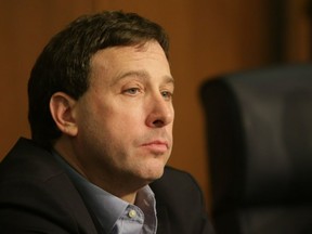 In this Jan. 31, 2017, photo St. Louis County Executive Steve Stenger listens to public comment during a county council meeting in Clayton, Mo. Stenger has been indicted by a federal grand jury accusing him of providing political favors in exchange campaign donations.  The indictment on bribery, mail fraud and theft of honest services counts was announced Monday, April 29, 2019.