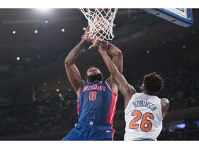 Detroit Pistons center Andre Drummond (0) goes to the basket against New York Knicks center Mitchell Robinson (26) during the first half of an NBA basketball game Wednesday, April 10, 2019, at Madison Square Garden in New York.