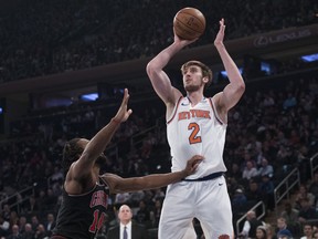 New York Knicks forward Luke Kornet (2) goes to the basket against Chicago Bulls forward JaKarr Sampson (14) during the first half of an NBA basketball game, Monday, April 1, 2019, at Madison Square Garden in New York.