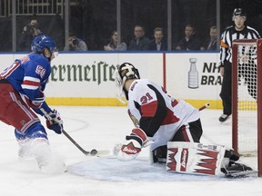 New York Rangers center Lias Andersson (50) scores a goal past Ottawa Senators goaltender Anders Nilsson (31) during the second period of an NHL hockey game, Wednesday, April 3, 2019, at Madison Square Garden in New York.