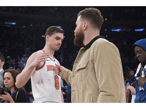 New York Knicks forward Mario Hezonja (8) greets Detroit Pistons forward Blake Griffin at the end of an NBA basketball game Wednesday, April 10, 2019, at Madison Square Garden in New York. The Pistons won 115-89.