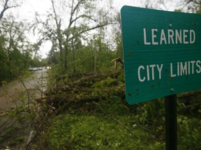 Fallen trees line the roads leading into the small community of Learned, Miss., Thursday, April 18, 2019. Several homes were damaged by fallen trees in the tree lined community. Strong storms again roared across the South on Thursday, topping trees and leaving more than 100,000 people without power across Mississippi, Louisiana and Texas.