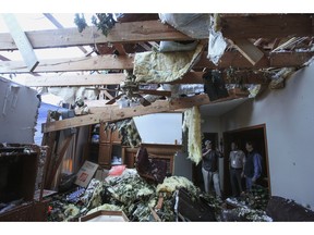 Pat McGuffie speaks with Warren County Sheriff Martin Pace and Lt. Gov. Tate Reeves about the damage at his home in Warren County, Miss., Tuesday, April 16, 2019, following Saturday evening's tornados that swept through Vicksburg and Warren County.