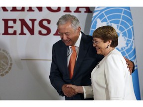 Mexican President Andres Manuel Lopez Obrador and Michelle Bachelet, United Nations High Commissioner for Human Rights, shake hands during a signing ceremony at the National Palace in Mexico City, Tuesday, April 9, 2019. Bachelet said Tuesday that her office will offer technical assistance to ensure that Mexico's newly formed National Guard respects human rights.
