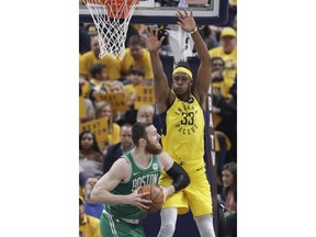 Boston Celtics center Aron Baynes (46) looks to shoot over Indiana Pacers center Myles Turner (33) during the first half of Game 3 of an NBA basketball first-round playoff series Friday, April 19, 2019, in Indianapolis.