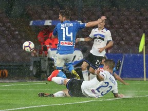 Napoli's Dries Mertens scores his team's first goal during the Italian Serie A soccer match between Napoli and Atalanta at the San Paolo stadium in Naples, Italy, Monday, April 22, 2019.