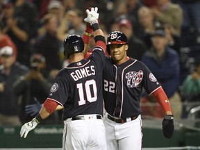 Washington Nationals' Yan Gomes (10) celebrates his two-run home run with Juan Soto (22) during the fourth inning of a baseball game against the San Diego Padres, Friday, April 26, 2019, in Washington.