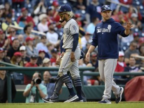 San Diego Padres shortstop Fernando Tatis Jr., front left, leaves a baseball game after being injured during the tenth inning of a baseball game against the Washington Nationals, Sunday, April 28, 2019, in Washington.