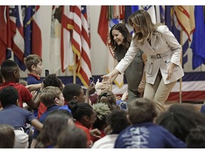 First lady Melania Trump, right, and second lady Karen Pence, left, greet student at Albritton Middle School in Fort Bragg, N.C., Monday, April 15, 2019.