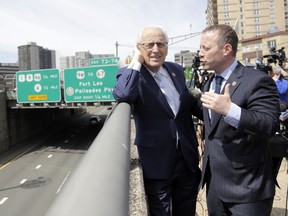 U.S. Rep.  Josh Gottheimer (NJ-5), right, and and Rep. Bill Pascrell (NJ-9) talk about traffic on the George Washington Bridge following a news conference near the bridge talking about the congressmen's plan to fight back against New York City's proposed congestion tax on New Jersey commuters, Wednesday, April 17, 2019, in Fort Lee, N.J. The congressmen announced legislation they say will ensure New Jersey motorists, who already pay up to $15 for bridge or tunnel tolls, won't be charged twice. New York's legislature approved a conceptual plan this month. that will allocate revenue to fix the city's mass transit system. New York would become the first American city to use so-called congestion pricing to reduce gridlock and fund mass transit improvements.