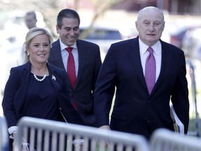 Bridget Anne Kelly, left, the former Deputy Chief of Staff for former New Jersey Gov. Chris Christie, walks with her lawyer Michael Critchley, right, and an associate while arriving at the Martin Luther King, Jr., Federal Courthouse for a re-sentencing hearing, Wednesday, April 24, 2019, in Newark, N.J. Kelly was convicted in 2016 in the alleged plot to cause traffic jams to punish a mayor for not endorsing Christie's re-election bid.