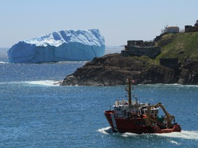 A huge iceberg floats in the harbor of St.John's , Newfoundland, Canada. June 13, 2014