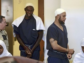 FILE - This Aug. 13, 2018 pool file photo shows defendants, from left, Jany Leveille, Lucas Morton, Siraj Ibn Wahhaj and Subbannah Wahhaj entering district court in Taos, N.M. U.S. prosecutors will not seek the death penalty against the four adults who lived at a New Mexico compound where authorities found the remains of a toddler who was reported missing in Georgia, court documents say.