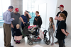 Dr. Gregor Andelfinger meets with his patient, two-year-old Lyana Deslauriers (bottom) and her family.