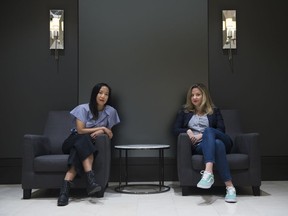 Co-editors Jen Sookfong Lee, left, and Stacey May Fowles pose for a photograph in Toronto on Wednesday, April 10, 2019. The two collected essays by sexual-assault survivors, and created a book called "Whatever Gets You Through."