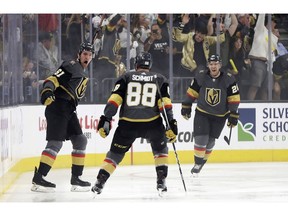 Vegas Golden Knights right wing Mark Stone, left, celebrates after scoring against the San Jose Sharks during the first period of Game 3 of an NHL first-round hockey playoff series game, Sunday, April 14, 2019, in Las Vegas.
