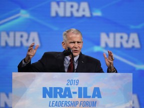 In this Friday, April 26, 2019 photo, National Rifle Association President Col. Oliver North speaks at the National Rifle Association Institute for Legislative Action Leadership Forum in Lucas Oil Stadium in Indianapolis. On Saturday, North announced that he will not serve a second term as the president of the NRA amid inner turmoil in the gun-rights group.