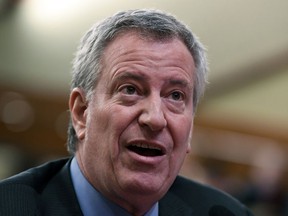 FILE - In this Feb. 11, 2019 file photo, New York City Mayor Bill de Blasio testifies during a joint legislative budget hearing on local government in Albany, N.Y.  De Blasio has announced a ban of alcohol advertising on city property. The ban, which takes effect immediately, includes bus shelters, newsstands, Wi-Fi kiosks and recycling kiosks. Existing ads will be allowed to remain until their contracts end.