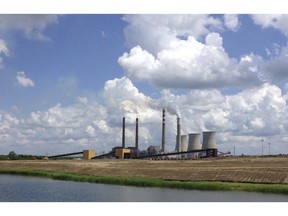 FILE - In a June 3, 2014, photo, the Paradise Fossil Plant stands in Drakesboro Ky. The new head of the Tennessee Valley Authority says a decision to shut down the Kentucky coal-fired power plant, which drew a critical tweet from President Trump, was the right one. Jeff Lyash took over as president and CEO of the nation's largest public utility on Monday, April 8, 2019. In an interview with The Associated Press on Friday, Lyash said the Paradise Fossil Plant is at the end of its life and was no longer cost effective to operate.