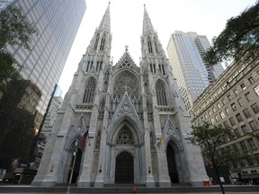 This Sunday, Aug. 30, 2015 file photo shows the newly renovated and cleaned facade of St. Patrick's Cathedral in New York. The Archdiocese of New York says at least 120 priests accused of sexually abusing a child or having child pornography have worked there over decades. The nation's second-largest archdiocese released a list of names on Friday, April 26, 2019.