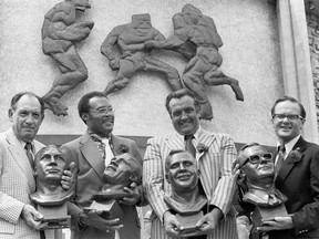 RETRANSMISSION TO CORRECT AGE TO 93 - FILE - In this July 29, 1972 file photo, Pro Hall of Fame enshrinees, from left: Clarence "Ace" Parker, Ollie Matson, Gino Marchetti and Lamar Hunt pose after induction ceremonies at the Hall of Fame in Canton, Ohio. Marchetti, an undersized Hall of Fame defensive tackle who helped the Baltimore Colts win two NFL championships, has died. He was 93.