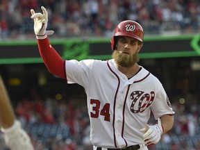 FILE - In this April 30, 2017, file photo, Washington Nationals' Bryce Harper gestures after his home run during the eighth inning of a baseball game against the New York Mets, in Washington.  From the moment Bryce Harper signed his $330 million, 13-year deal with the Philadelphia Phillies, this game is the one everyone has been thinking about. Tuesday night marks Harper's initial visit to Nationals Park to face his former team.