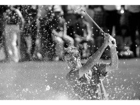 FILE - In this April 15, 1979 file photo ,Ed Sneed, early leader in the final day of the Masters, hits out of the sand on number 6. Sneed bogeyed the hole in Augusta, Ga. He wound up bogeying the last three holes and losing in a playoff. (AP Photo/File)