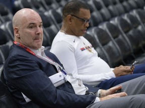 FILE - In this Feb. 23, 2019, file photo, New Orleans Pelicans interim general manager Danny Ferry, left, and coach Alvin Gentry watch players warm up for the team's NBA basketball game against the Los Angeles Lakers in New Orleans. A person familiar with the process says the Pelicans have begun interviewing candidates to become the club's new general manager. The person says the list of candidates includes Ferry, as well as former Cleveland Cavaliers general manager David Griffin, Golden State assistant GM Larry Harris, Brooklyn Nets assistant GM Trajan Langon, Houston Rockets assistant GM Gersson Rosas and interim Washington president of basketball operations Tommy Sheppard.