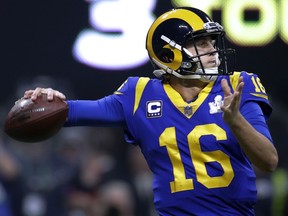 FILE - In this Sunday, Feb. 3, 2019 file photo, Los Angeles Rams' Jared Goff drops back to pass against the New England Patriots during the second half of the NFL Super Bowl 53 football game in Atlanta. The Los Angeles Rams have exercised their fifth-year contract option on quarterback Jared Goff for the 2020 season. Rams general manager Les Snead announced the long-anticipated move Tuesday, April 23, 2019. He also affirmed the NFC champions' plan to sign Goff to a long-term contract.