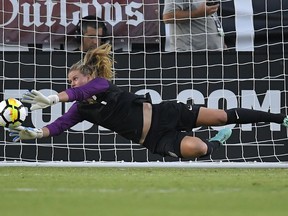 FILE - In this Aug. 3, 2017, file photo, U.S. goalkeeper Alyssa Naeher stops a shot against Japan during the first half of a Tournament of Nations soccer match, in Carson, Calif. Naeher recalls that as a freshman in college a teammate told her she couldn't afford to be intimidated. The U.S. national team goalkeeper carries that advice as she prepares for the World Cup.