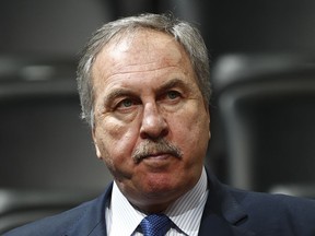 FILE - In this March 8, 2017, file photo, Washington Wizards general manager Ernie Grunfeld watches during the first half of an NBA basketball game in Denver. Grunfeld has been fired as president of the Washington Wizards after 16 seasons in charge of the team. The Wizards announced his dismissal on Tuesday, April 2, 2019,  with four games left in a disappointing, no-playoffs season.