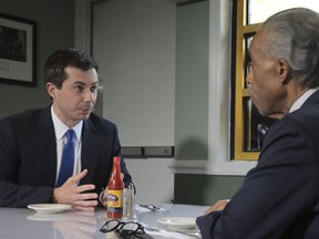 Democratic presidential candidate Mayor Pete Buttigieg, from South Bend, Indiana, and civil rights leader Rev. Al Sharpton, right, President of National Action Network, hold a lunch meeting at Sylvia's Restaurant in Harlem, New York, Monday, April 29, 2019.
