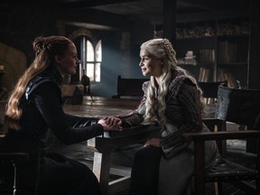 This image released by HBO shows Sophie Turner, left, Emilia Clarke in a scene from "Game of Thrones," that aired Sunday, April 21, 2019. With the Game of Thrones' Jon Snow revealing his royal lineage to his potential rival Daenerys Targaryen, the beleaguered army at Winterfell is about to find out if two chief executives better than one.