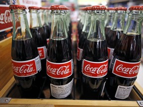 FILE - This Nov. 14, 2018, file photo shows Coca-Cola on display at a market in Pittsburgh. The Coca-Cola Co. reports financial results Tuesday, April 23, 2019.