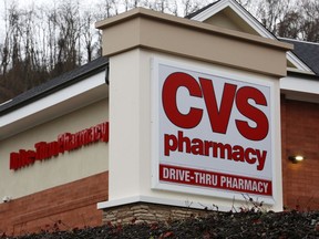 FILE - This Jan. 18, 2017, file photo shows a CVS Pharmacy in Pittsburgh. CVS Health is expanding same-day prescription deliveries nationwide in the latest push by drugstores to keep customers who don't want to wait and are doing more shopping online.