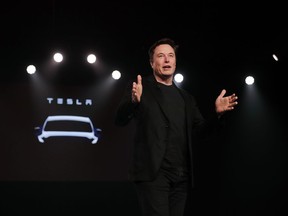 FILE- In this March 14, 2019, file photo Tesla CEO Elon Musk speaks before unveiling the Model Y at Tesla's design studio in Hawthorne, Calif.  A federal judge will hear oral arguments Thursday, April 4, about whether Tesla CEO Elon Musk should be held in contempt of court for violating an agreement with the U.S. Securities and Exchange Commission.